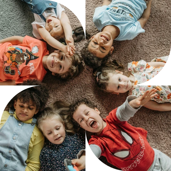 Smiling children lying down on the floor