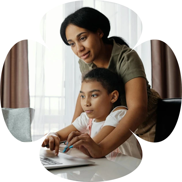 A woman teaching a student on the laptop